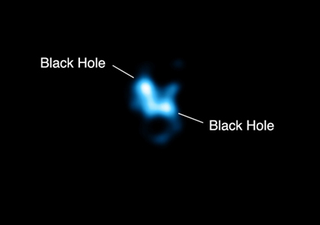 Illustration for article titled What happens when one black hole eats another black hole?